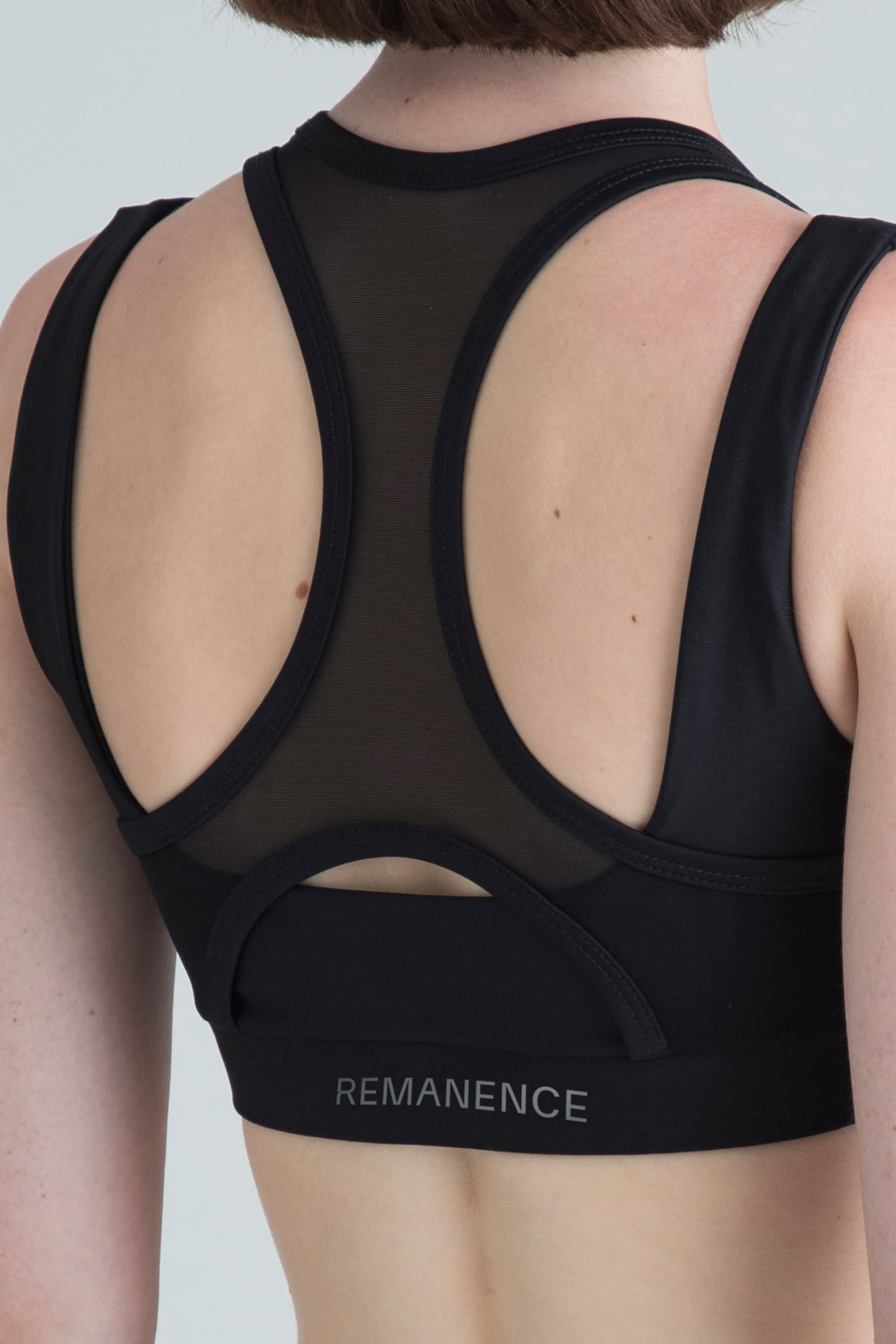 Top deportivo negro para mujer Apex detalle de espalda deportiva mesh