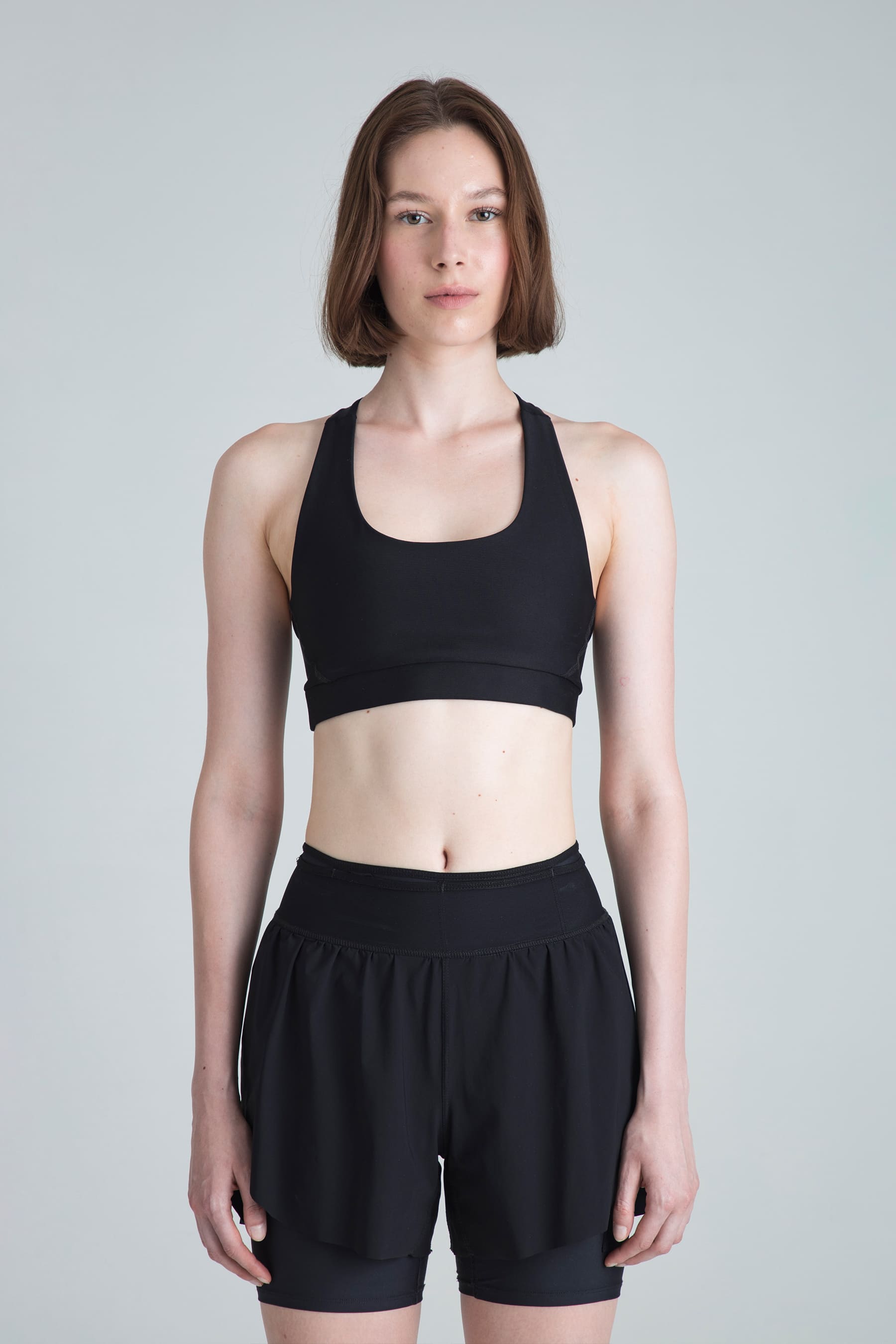Top deportivo negro para mujer Motion soporte medio en modelo 