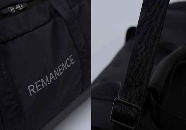 Detalles del duffel negro Remanence con correas texturizadas y logo frontal, ideal para uso urbano o escapadas cortas.